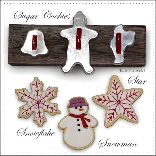 Picture of Sugar Cookies easy stitch kit with Snowman, Star and Snowflake hanging from a Vintage cookie cutter hanger